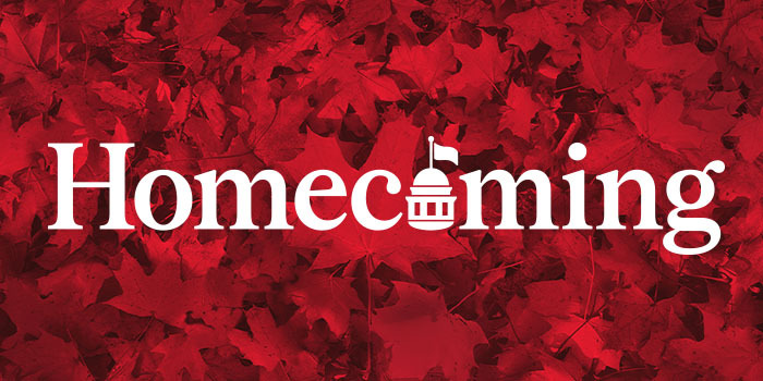 The words Homecoming with red leaves in the background